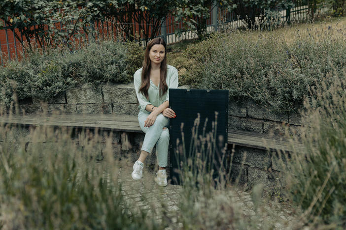 Karolina Attspodina, a Ukrainian-born tech entrepreneur who launched the startup We Do Solar in Berlin, with one of her company's solar panels. Attspodina's work is part of nationwide push to get Germans to use less energy and lessen dependence on Russian oil.