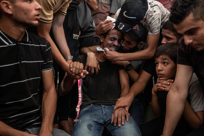 Relatives of Lian al-Shaer, a 10-year-old Palestinian girl, mourn during her funeral ceremony in Khan Yunis in the southern Gaza Strip on Aug. 11. Lian died of injuries sustained during the violence between Israel and Islamic Jihad.