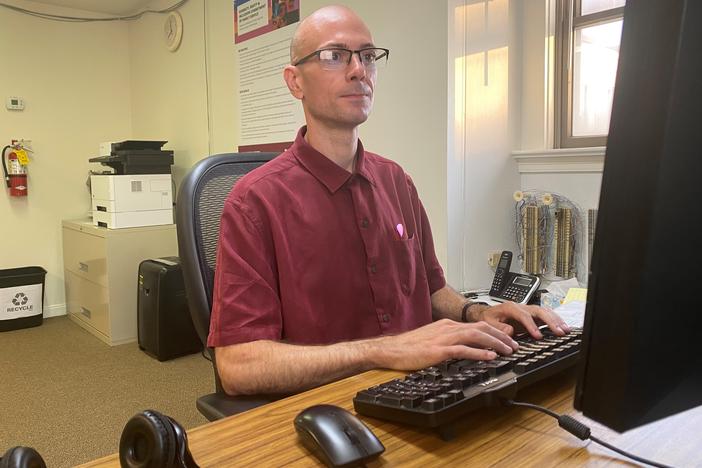 Call center specialist Michael Colluccio works on a team that answers 988 calls from people whose phones have area codes for the suburban Philadelphia region. If needed, Colluccio also can answer calls from other parts of the state or country, part of a system that makes sure someone is always available to talk.