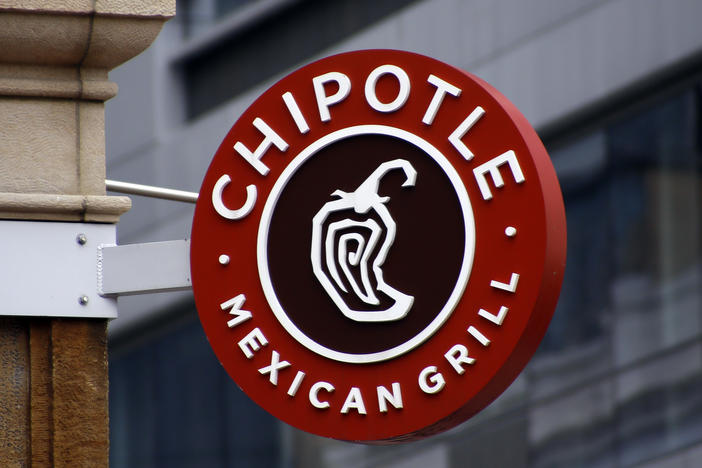 A Chipotle sign hangs outside the chain restaurant in Pittsburgh on Feb. 8, 2016. In June 2022, employees of the Augusta, Maine, Chipotle filed a petition with the National Labor Relations Board asking to hold a union election at the store. The NLRB had scheduled a hearing July 19, 2022. But Chipotle announced the same day it was permanently closing the store.