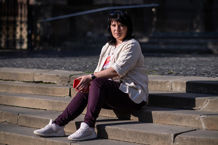 Olha Kerod, the wife of a Ukrainian soldier who was captured by Russian forces in Mariupol, poses in front of the Church of Sts. Olha and Elizabeth, where she often prays, in Lviv, Ukraine, on July 18. "I pray for all the soldiers, not just Stas," her husband, she says. "I will keep praying until they all come home."