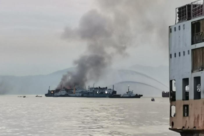 In this handout photo provided by the Philippine Coast Guard, smoke is seen from the M/V Asia Philippines, an inter-island cargo and passenger vessel, as it caught fire while it was approaching Batangas port, southern Philippines on Friday.