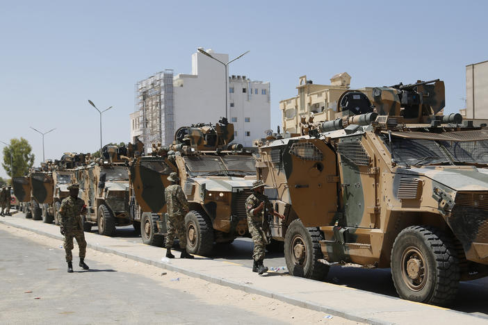 Libyan forces are deployed in Tripoli, Libya, on Saturday. Clashes broke out early Saturday between rival militias in Libya's capital, a health official said.
