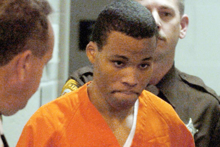 In a 2004 photo, convicted sniper Lee Boyd Malvo enters a courtroom in the Spotsylvania Circuit Court in Spotsylvania, Va. Maryland's highest court ruled on Friday that Malvo must be resentenced because of U.S. Supreme Court decisions relating to constitutional protections for juveniles made after Malvo was sentenced to six life sentences without the possibility of parole.