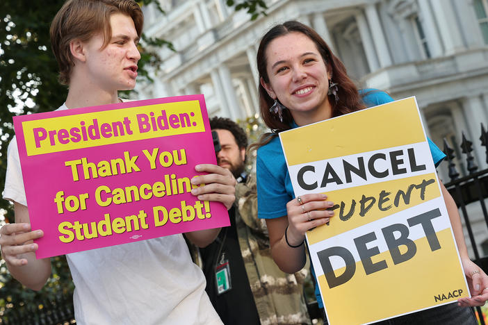 Student loan borrowers stage a rally in front of The White House on Aug. 25 to celebrate President Biden cancelling student debt. The plan has sparked heated debate, including about its economic fairness.