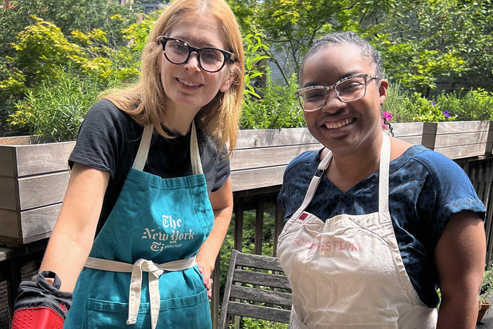 Melissa Clark and NPR's Ayesha Rascoe pose with the cheesy baked pasta.