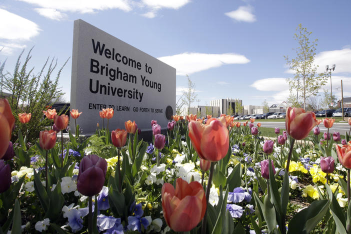 This April 19, 2016, file photo, shows a welcome sign to Brigham Young University in Provo, Utah. BYU says it has banned a fan that yelled racist slurs at a Duke University volleyball player this weekend.