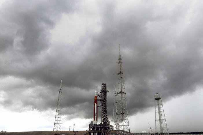 Storm clouds roll in over the NASA moon rocket as it stands ready for launch on Pad 39B for the Artemis 1 mission at the Kennedy Space Center, on Saturday in Cape Canaveral, Fla.