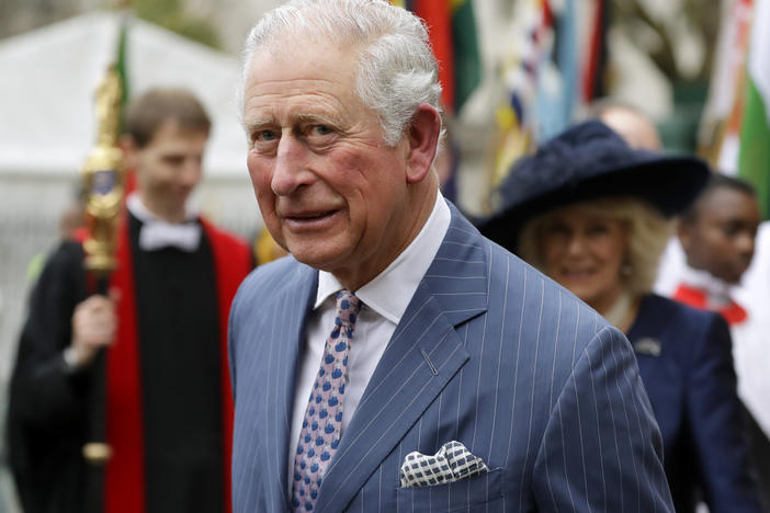 In this Monday, March 9, 2020, photo, Britain's Prince Charles and Camilla the Duchess of Cornwall, in the background, leave after attending the annual Commonwealth Day service at Westminster Abbey in London. The Prince of Wales has edited an edition of British African-Caribbean newspaper "The Voice" to mark its 40-year anniversary.