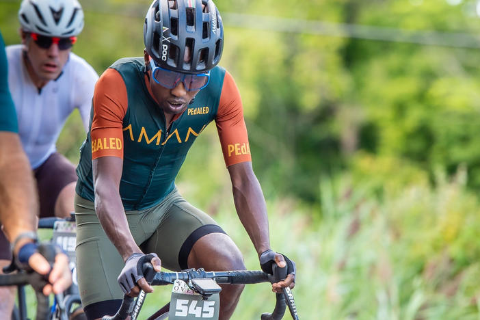 In this photo provided by Joseph Viger, Kenyan cyclist Sule Kangangi cycles at a gravel race in Vermont, Saturday, Aug. 27, 2022.