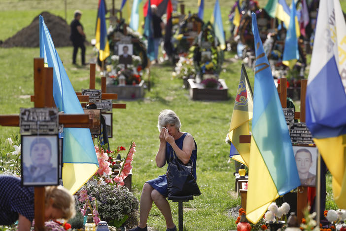 People attend a ceremony for the fallen soldiers of Ukraine on the Field of Mars on Aug. 24 in Lviv, Ukraine. The day marked six months since the start of Russia's large-scale invasion of Ukraine, as well as Ukraine's Independence Day.