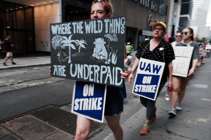 Employees of HarperCollins Publisher participate in a one-day strike outside the publishing houses offices in Manhattan on July 20, 2022 in New York City.