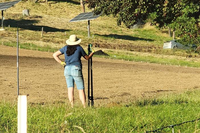 New farmer Bobbi Wilson stands on land in southern Oregon where she is prepping the land to grow vegetables.