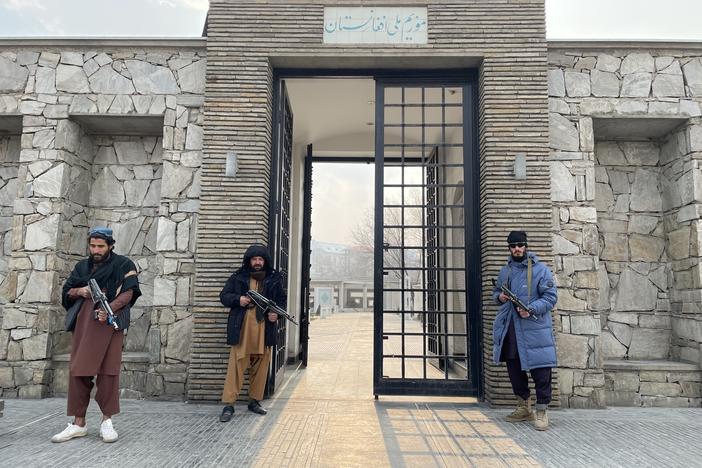 Taliban guards stand at the entrance of the National Museum of Afghanistan after it reopened under Taliban control in Kabul in December.