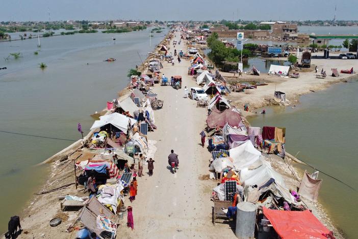 An aerial photo taken Wednesday shows people sheltering in a makeshift camp after heavy monsoon rains in the Jaffarabad district of Pakistan's Balochistan province.