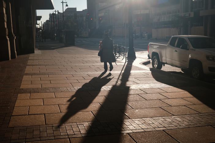A person walks down a street in Philadelphia, Pa.