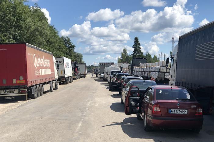 Cars and trucks line up for hours at Latvia's Terehova border crossing into Russia on Aug. 3.