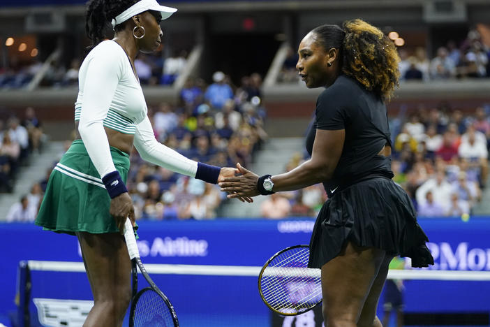 Serena Williams, right, and Venus Williams celebrate during their first-round doubles match against Lucie Hradecká and Linda Nosková, of the Czech Republic, at the U.S. Open tennis championships.