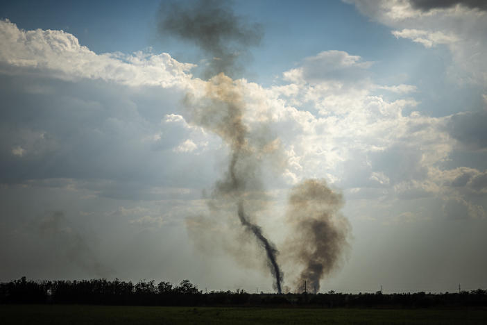 Black smoke rises at the front line in southern Ukraine's Mykolaiv Oblast on Aug. 30 amid Russia's military invasion of the country. Ukraine has begun a major counteroffensive to retake areas in the south that Russia seized early in the war.