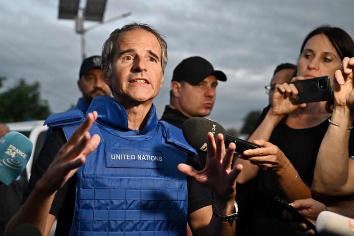 International Atomic Energy Agency chief Rafael Mariano Grossi talks to reporters on a road outside the city of Zaporizhzhia after his visit to the Russian-held Zaporizhzhia nuclear power plant in southern Ukraine on Sept. 1, amid the Russian invasion of Ukraine.