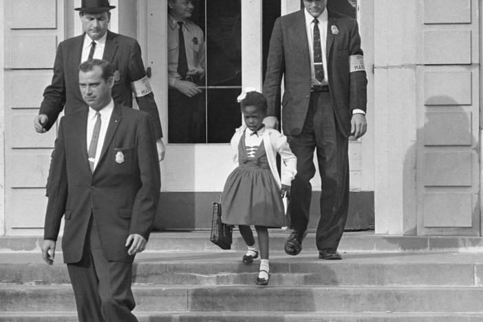 U.S. deputy marshals escort six-year-old Ruby Bridges from William Frantz Elementary School in New Orleans in November 1960.