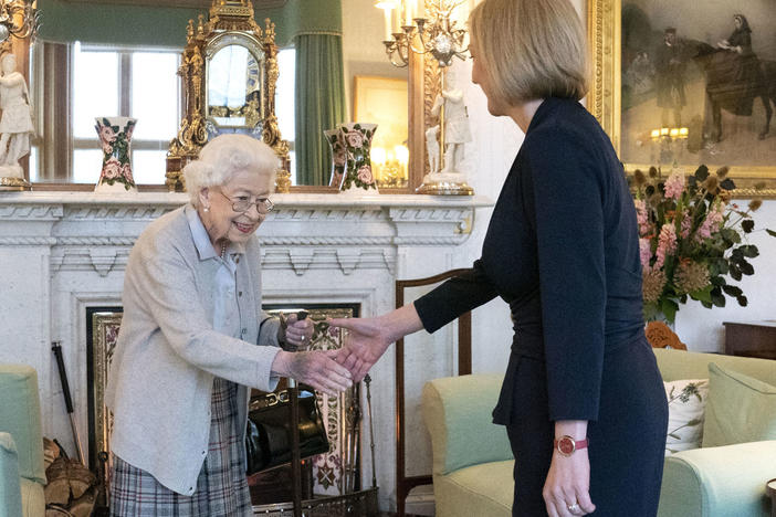 Queen Elizabeth II welcomes Liz Truss on Tuesday during an audience at Balmoral, Scotland, where the monarch invited the newly elected leader of the Conservative Party to become prime minister and form a new government.