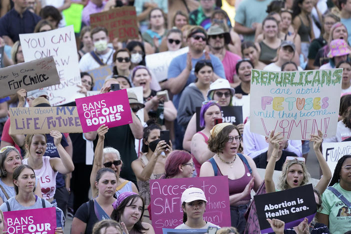 Abortion rights protesters attend a rally outside the state Capitol in Lansing, Mich., on June 24, following the U.S. Supreme Court's decision to overturn Roe v. Wade.