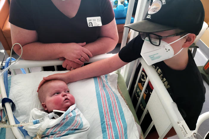 Bennett Markow looks to his big brother, Eli (right), during a family visit at UC Davis Children's Hospital in Sacramento. Bennett was born four months early, in November 2020.