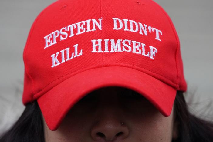 A protester outside of the Maxwell trial wearing a hat claiming that Epstein's death was not a suicide.