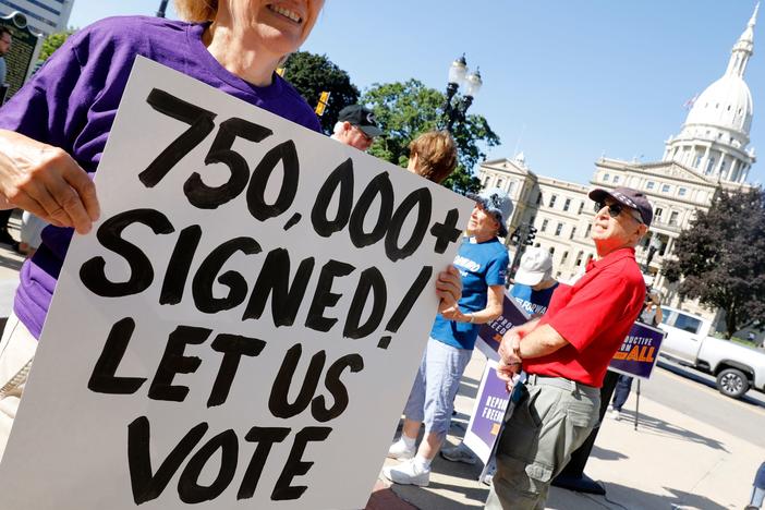 Abortion rights supporters gather outside the Michigan Capitol in Lansing, Mich., during a rally on September 7, 2022.