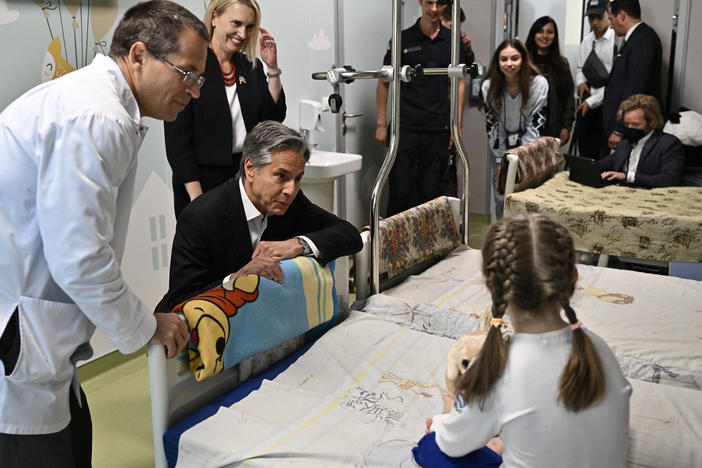 U.S. Secretary of State Antony Blinken talks with Marina, 6, from Ukraine's Kherson region, during his visit to a children's hospital in Kyiv on Thursday.