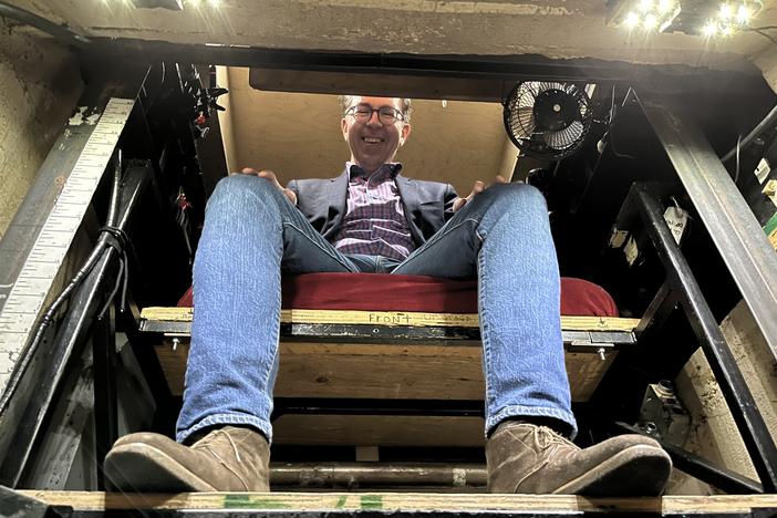 San Francisco Opera prompter Matthew Piatt sits in the prompter's box at the War Memorial Opera House.