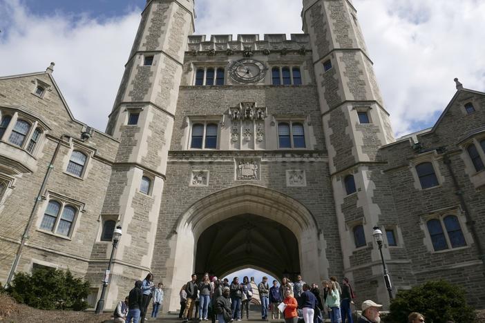 In this April 5, 2018, file photo, people walk through the Princeton University campus in Princeton, N.J.