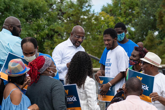 U.S. Sen. Raphael Warnock's campaign bus tour in Albany, Ga., on Aug. 29, 2022.