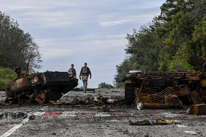 Destroyed armored vehicles litter the road in Balakliya, Kharkiv region, on Saturday.