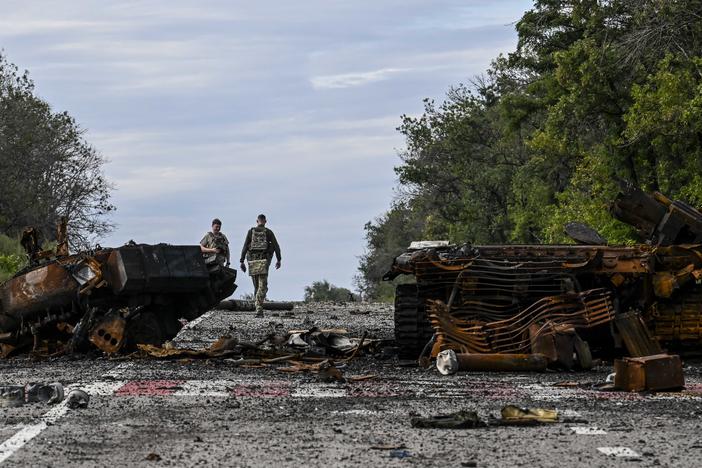 Destroyed armored vehicles litter the road in Balakliya, in Ukraine's Kharkiv region, on Saturday. Ukrainian forces said recaptured key towns and villages in the country's northeast.
