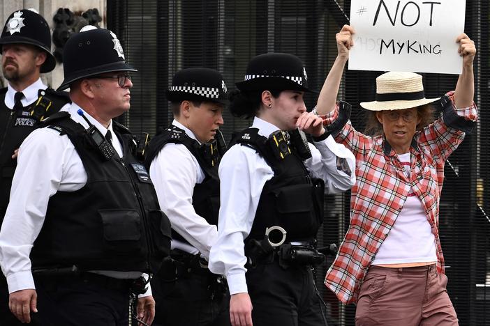 An anti-monarchy demonstrator protests outside Palace of Westminster in central London on Monday. A number of arrests in the U.K. are sparking questions about freedom of speech.