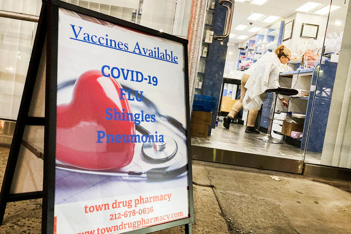 A pharmacy in New York City offers vaccines for COVID-19 and flu. Some researchers argue that the two diseases may pose similar risks of dying for those infected.