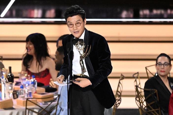 South Korean director Hwang Dong-hyuk accepts the award for Outstanding Directing For A Drama Series for <em>Squid Game</em> onstage during the 74th Emmy Awards.