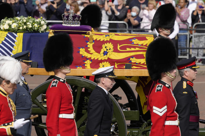 Grenadier Guards flank the coffin of Queen Elizabeth II during a procession from Buckingham Palace to Westminster Hall in London on Wednesday. The Queen will lie in state in Westminster Hall for four full days before her funeral on Monday.