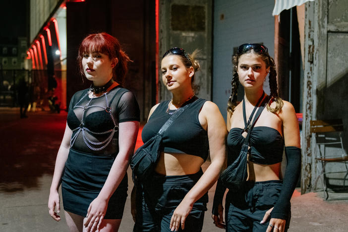 From left: Philippa, 23, from Sydney, Australia; Laura, 23, from Melbourne; and Isabella, 23, from Sydney wait in line to enter Tresor, one of Germany's popular nightclubs for electronic music, in Berlin in the early morning hours of Sept. 4.