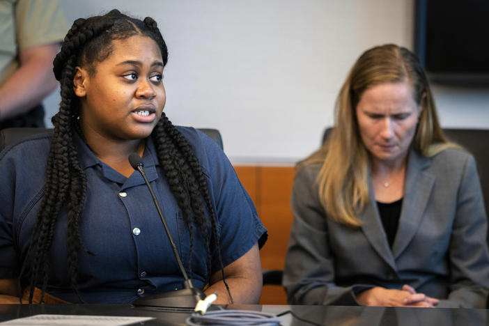 Pieper Lewis, left, speaks with Polk County District Judge David M. Porter during her sentencing hearing on Sept. 13. Donations are pouring in to help Lewis, a 17-year-old sex trafficking victim who was ordered by the court to pay $150,000 to the family of a man she stabbed to death after he raped her.