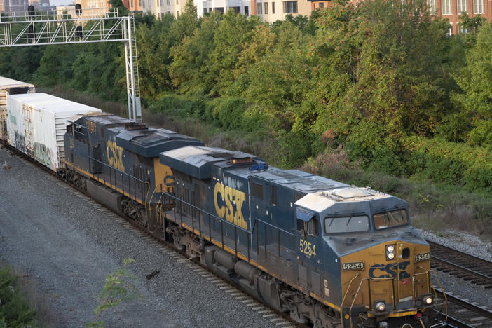 A tentative deal announced Thursday would avert a strike on the nation's freight lines with the potential to throw supply chains into chaos. Above, a CSX freight train travels through Alexandria, Va.