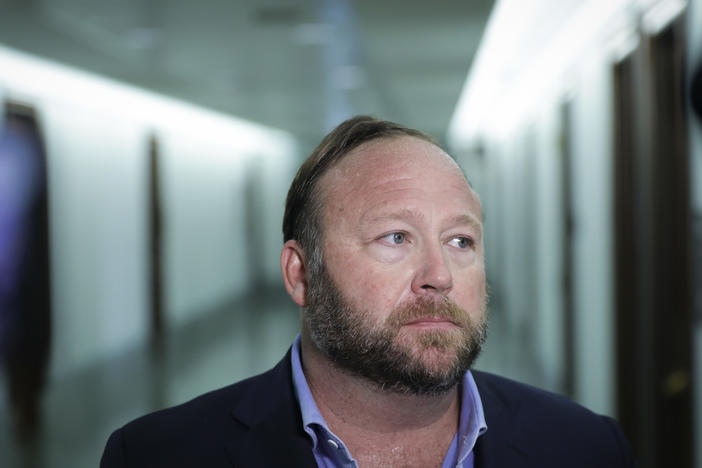 Conspiracy theorist Alex Jones, seen here in 2018, and his network of websites have been banned from most major online and social media platforms but have still managed to bring in tens of millions of dollars in revenue.