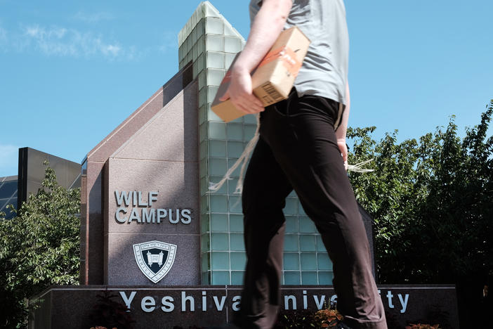 People walk by the campus of Yeshiva University in New York City on Aug. 30. A Supreme Court ruling left in place a New York state court ruling requiring the university to recognize the YU Pride Alliance.