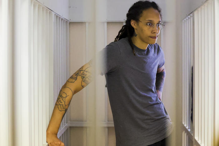 WNBA star and two-time Olympic gold medalist Brittney Griner stands listening to a verdict in a courtroom in Khimki just outside Moscow, Russia, on Aug. 4. Griner apologized to her family and teams as a Russian court heard closing arguments in her drug possession trial.