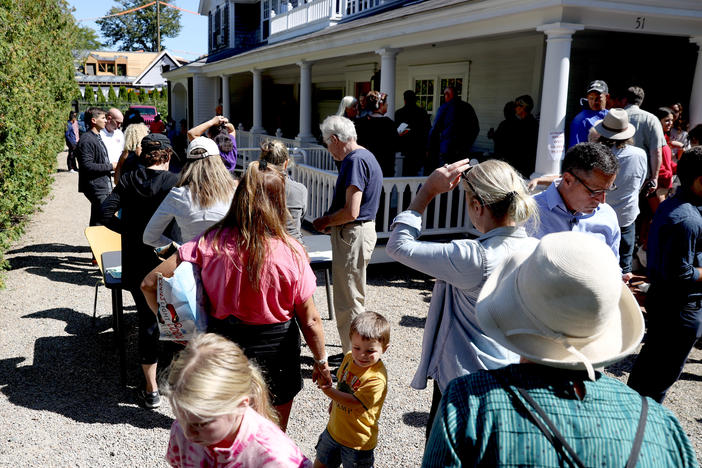 Marthas Vineyard residents line up in front of St. Andrews Parish House to donate food to the recently arrived migrants. Two planes of migrants from Venezuela arrived suddenly Wednesday night on Martha's Vineyard.