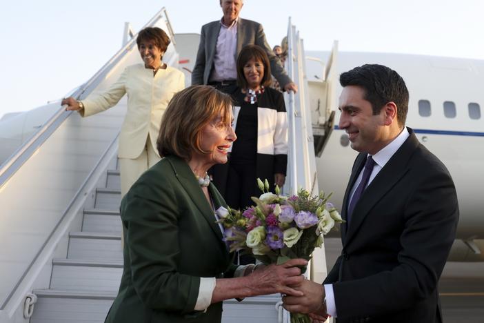 In this handout photo released by Armenian National Assembly via Photolure photo agency, Head of Armenian National Assembly Alen Simonyan, right, welcomes U.S. House of Representatives Nancy Pelosi upon her arrival at the International Airport outside of Yerevan, Armenia, Saturday, Sept. 17, 2022.