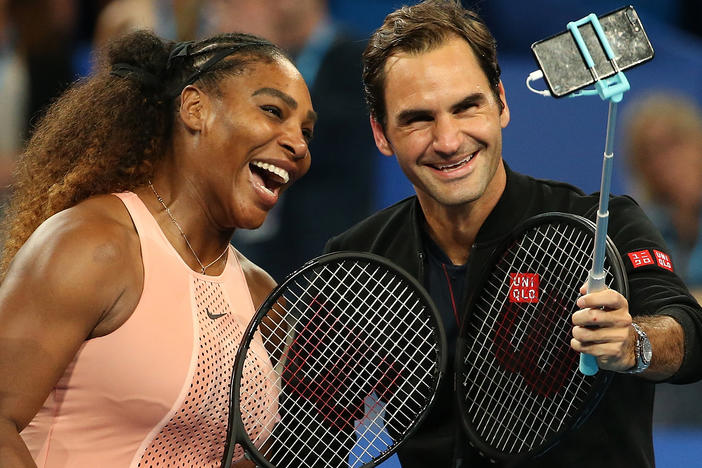 Serena Williams and Roger Federer take a selfie following their mixed doubles match on Jan. 1, 2019, in Perth, Australia.