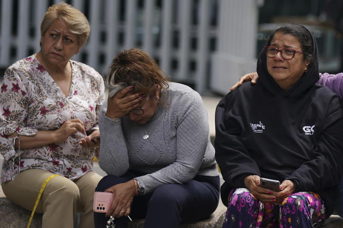 People gather outside after a magnitude 7.6 earthquake was felt in Mexico City on Monday, Sept. 19. The quake hit at 1:05 p.m. local time, according to the U.S. Geologic Survey, which said the quake was centered near the boundary of Colima and Michoacan states.